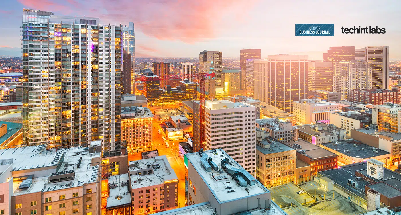 Aerial view of downtown Denver skyline at sunset featuring Techint Labs Denver Business Journal recognition